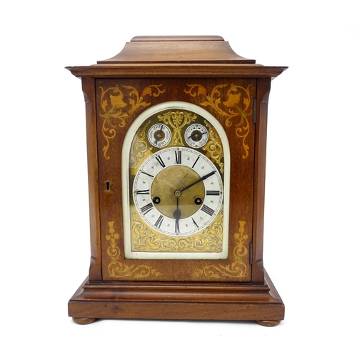 1493 - An early 20thC German 8 day mantel clock by Junghans, the case with inlaid detail. Approx. 16 3/4