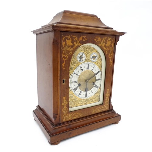 1493 - An early 20thC German 8 day mantel clock by Junghans, the case with inlaid detail. Approx. 16 3/4