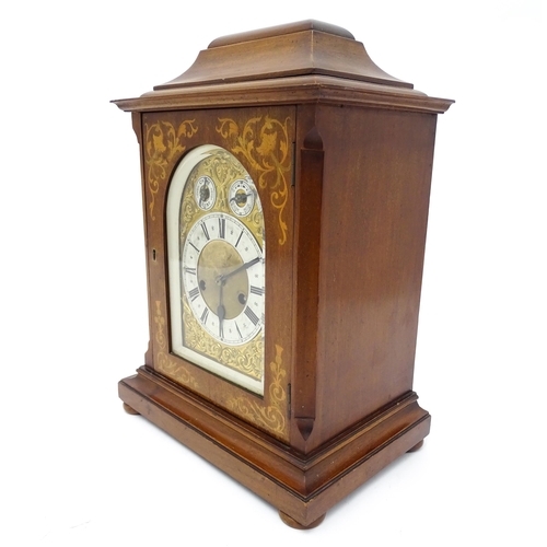 1493 - An early 20thC German 8 day mantel clock by Junghans, the case with inlaid detail. Approx. 16 3/4