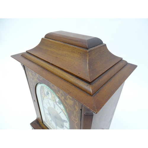 1493 - An early 20thC German 8 day mantel clock by Junghans, the case with inlaid detail. Approx. 16 3/4