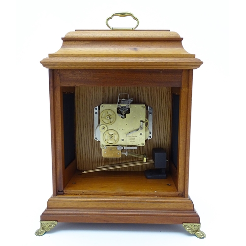 1495 - A 20thC German walnut cased 8 day bracket / mantel clock by Franz Hermle. Approx. 16 3/4