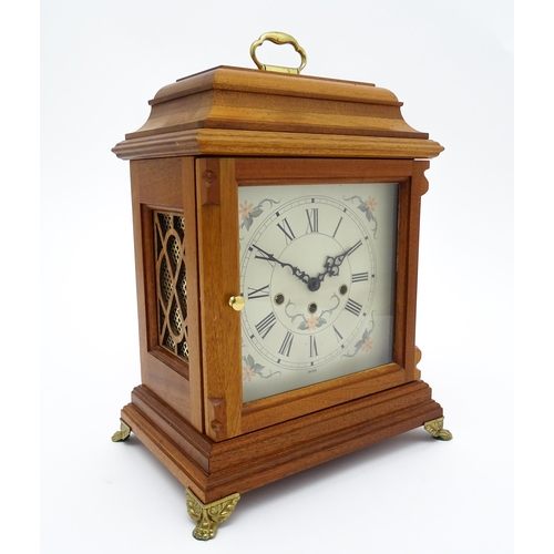 1495 - A 20thC German walnut cased 8 day bracket / mantel clock by Franz Hermle. Approx. 16 3/4