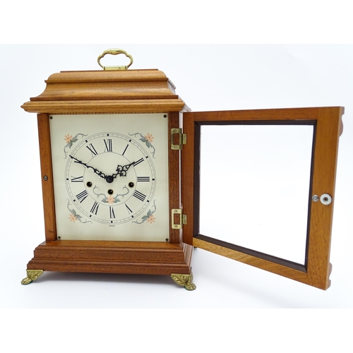 1495 - A 20thC German walnut cased 8 day bracket / mantel clock by Franz Hermle. Approx. 16 3/4