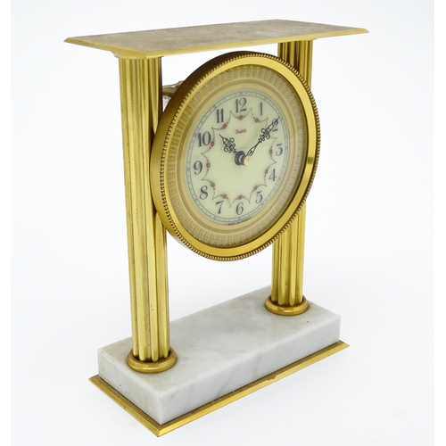 1496 - A 20thC French mantel clock with column style detail and marble base, the dial signed Vedette. Appro... 