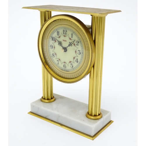 1496 - A 20thC French mantel clock with column style detail and marble base, the dial signed Vedette. Appro... 