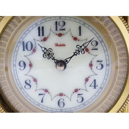 1496 - A 20thC French mantel clock with column style detail and marble base, the dial signed Vedette. Appro... 