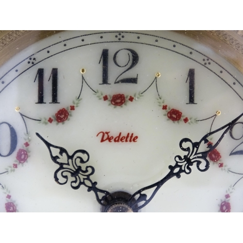 1496 - A 20thC French mantel clock with column style detail and marble base, the dial signed Vedette. Appro... 