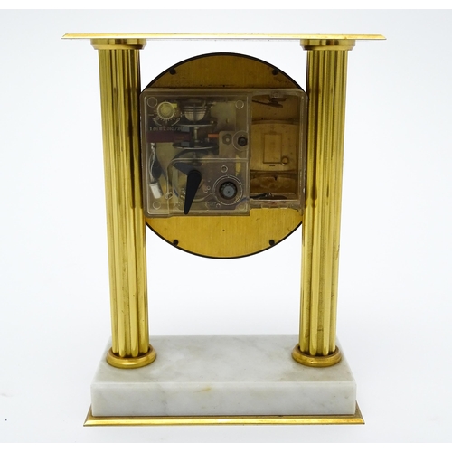 1496 - A 20thC French mantel clock with column style detail and marble base, the dial signed Vedette. Appro... 