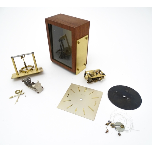 1499 - A walnut clock case. Together with assorted clock parts, and dial signed Hettich. Approx. 7 3/4