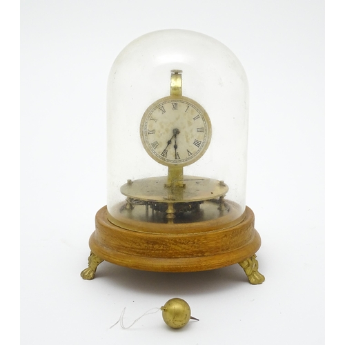 1501 - A 20thC Briggs Rotary flying ball pendulum style clock, mounted on a turned wooden base and having a... 