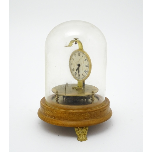 1501 - A 20thC Briggs Rotary flying ball pendulum style clock, mounted on a turned wooden base and having a... 