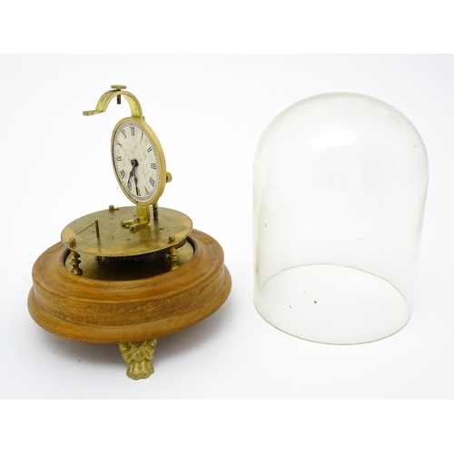 1501 - A 20thC Briggs Rotary flying ball pendulum style clock, mounted on a turned wooden base and having a... 