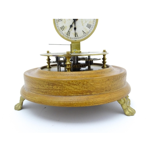 1501 - A 20thC Briggs Rotary flying ball pendulum style clock, mounted on a turned wooden base and having a... 