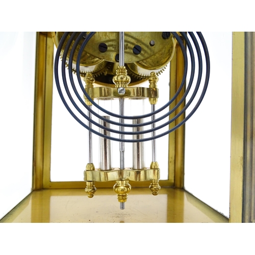 1503 - An American 20thC brass four glass mantle clock / regulator, the 8-day movement striking on a gong r... 