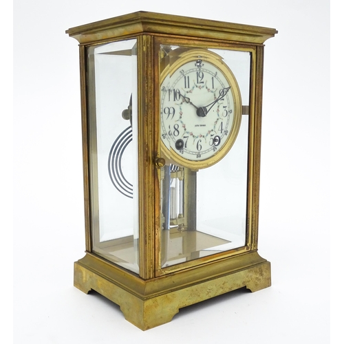 1503 - An American 20thC brass four glass mantle clock / regulator, the 8-day movement striking on a gong r... 