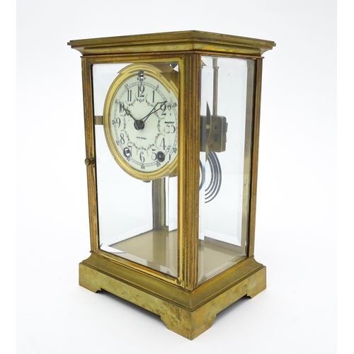 1503 - An American 20thC brass four glass mantle clock / regulator, the 8-day movement striking on a gong r... 