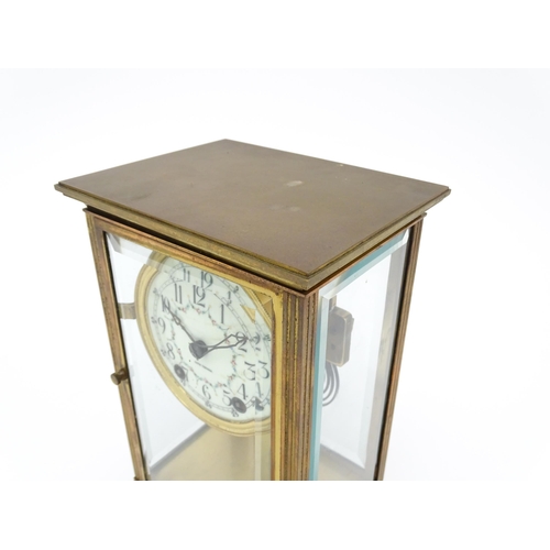 1503 - An American 20thC brass four glass mantle clock / regulator, the 8-day movement striking on a gong r... 