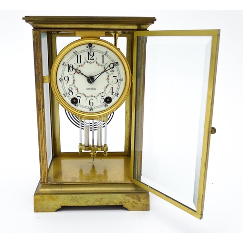 1503 - An American 20thC brass four glass mantle clock / regulator, the 8-day movement striking on a gong r... 