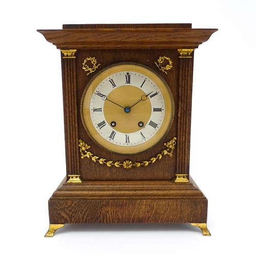 1504 - A German oak cased 8 day mantel clock, the movement marked Lenzkirch and striking on a gong. Approx.... 