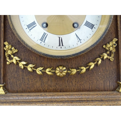 1504 - A German oak cased 8 day mantel clock, the movement marked Lenzkirch and striking on a gong. Approx.... 