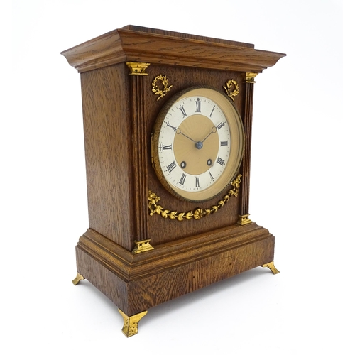 1504 - A German oak cased 8 day mantel clock, the movement marked Lenzkirch and striking on a gong. Approx.... 