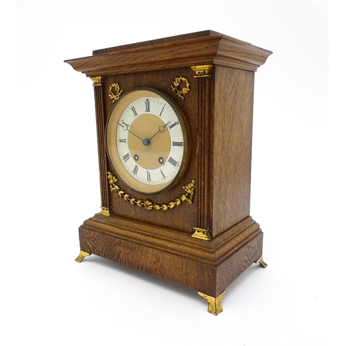 1504 - A German oak cased 8 day mantel clock, the movement marked Lenzkirch and striking on a gong. Approx.... 