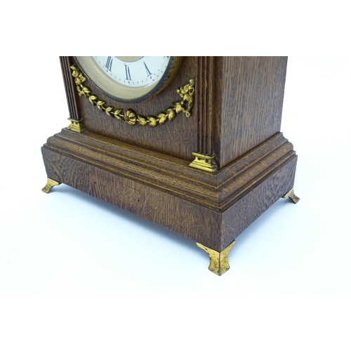 1504 - A German oak cased 8 day mantel clock, the movement marked Lenzkirch and striking on a gong. Approx.... 