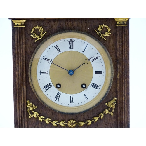 1504 - A German oak cased 8 day mantel clock, the movement marked Lenzkirch and striking on a gong. Approx.... 