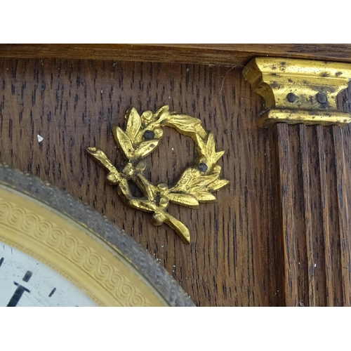 1504 - A German oak cased 8 day mantel clock, the movement marked Lenzkirch and striking on a gong. Approx.... 