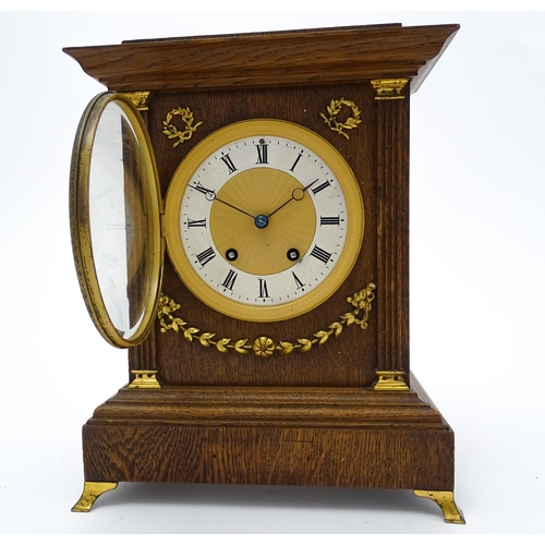 1504 - A German oak cased 8 day mantel clock, the movement marked Lenzkirch and striking on a gong. Approx.... 