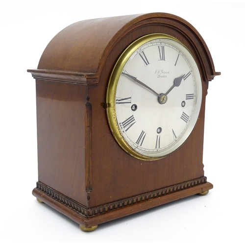 1506 - A mahogany cased mantel clock, the dial with Roman hour marks and signed J. W. Benson, London, the 8... 