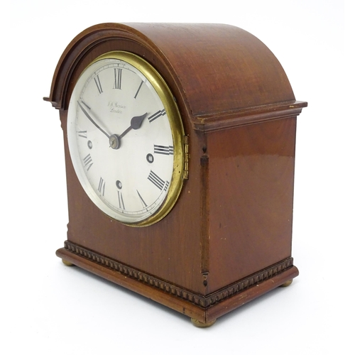 1506 - A mahogany cased mantel clock, the dial with Roman hour marks and signed J. W. Benson, London, the 8... 