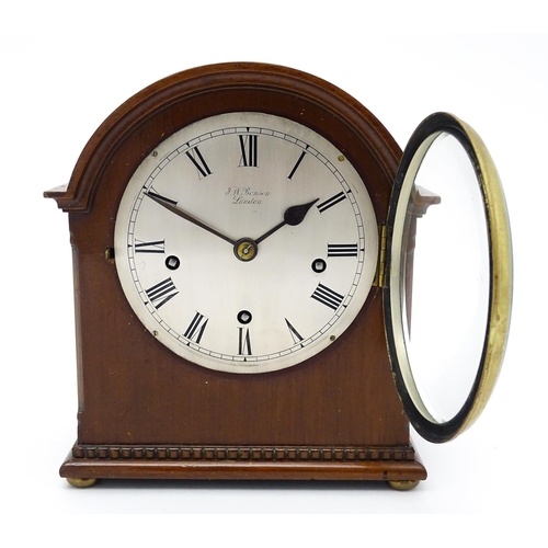 1506 - A mahogany cased mantel clock, the dial with Roman hour marks and signed J. W. Benson, London, the 8... 