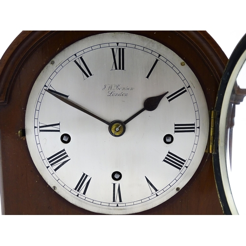 1506 - A mahogany cased mantel clock, the dial with Roman hour marks and signed J. W. Benson, London, the 8... 