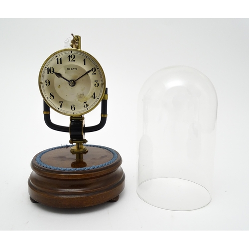 1507 - A Bulle type electric torsion 800 day mantel clock under dome. Approx. 10 1/2