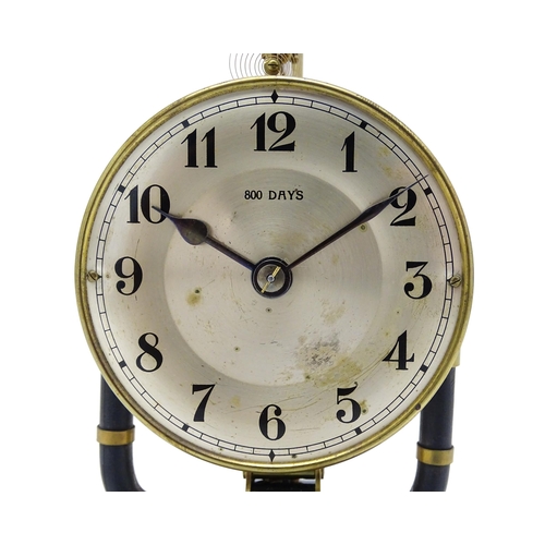 1507 - A Bulle type electric torsion 800 day mantel clock under dome. Approx. 10 1/2