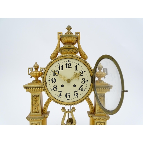 1508 - An early 20thC German gilt brass 8 day mantel clock by Lenzkircher, the dial with Arabic numerals, t... 