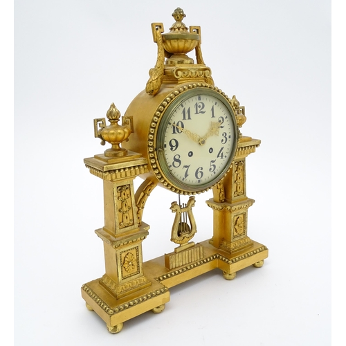 1508 - An early 20thC German gilt brass 8 day mantel clock by Lenzkircher, the dial with Arabic numerals, t... 