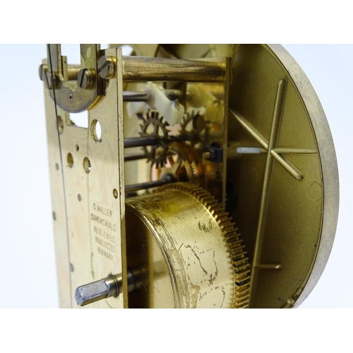 1510 - A late 20thC anniversary / torsion clock by Haller. Approx. 11 3/4