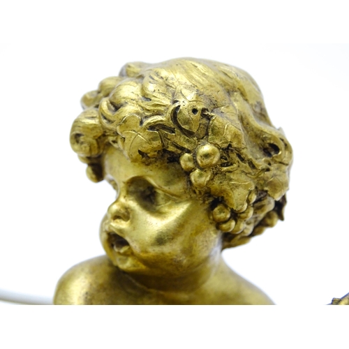 1532 - A pair of Continental gilt bronze twin branch table lamps, each modelled as a seated faun playing a ... 