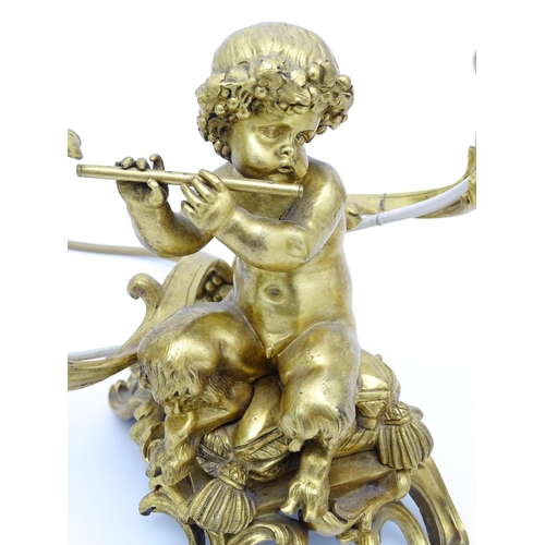 1532 - A pair of Continental gilt bronze twin branch table lamps, each modelled as a seated faun playing a ... 