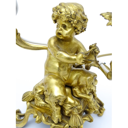 1532 - A pair of Continental gilt bronze twin branch table lamps, each modelled as a seated faun playing a ... 