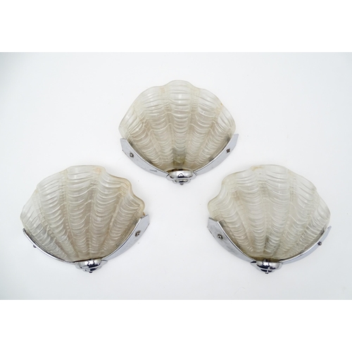 1534 - Three retro chrome and frosted glass wall lights of shell form. Approx. 8