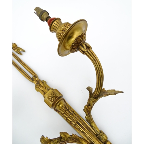 1550 - A pair of brass 20thC twin branch wall sconces with bow cresting and acanthus scroll detail. Approx.... 