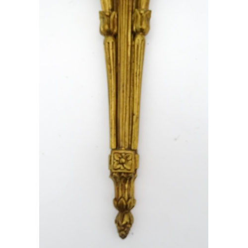 1550 - A pair of brass 20thC twin branch wall sconces with bow cresting and acanthus scroll detail. Approx.... 