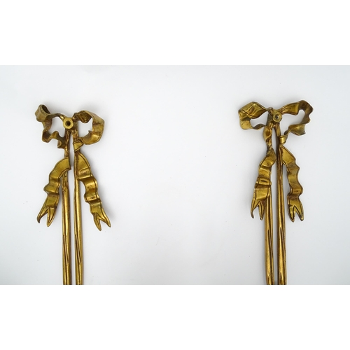 1550 - A pair of brass 20thC twin branch wall sconces with bow cresting and acanthus scroll detail. Approx.... 