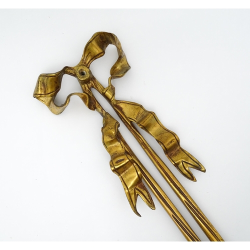 1550 - A pair of brass 20thC twin branch wall sconces with bow cresting and acanthus scroll detail. Approx.... 