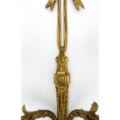 1550 - A pair of brass 20thC twin branch wall sconces with bow cresting and acanthus scroll detail. Approx.... 