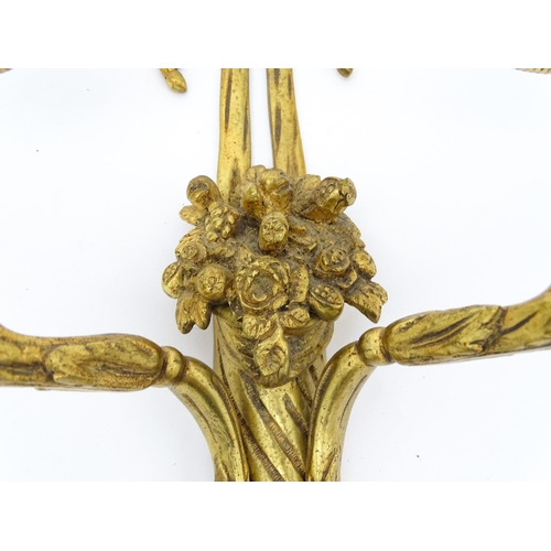 1551 - A pair of 20thC brass two branch wall sconces with bow cresting and fruiting cornucopia detail detai... 