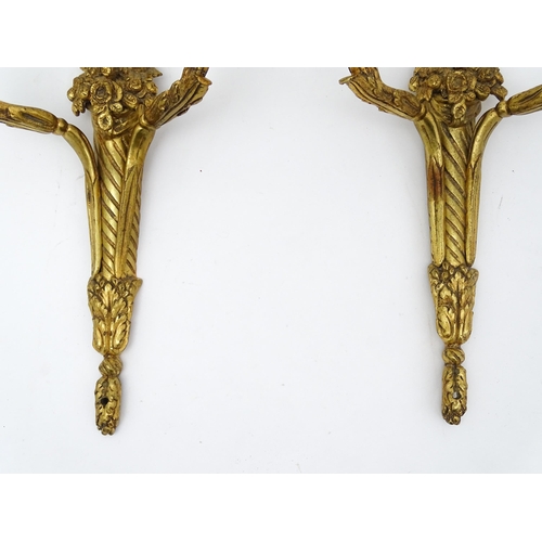 1551 - A pair of 20thC brass two branch wall sconces with bow cresting and fruiting cornucopia detail detai... 